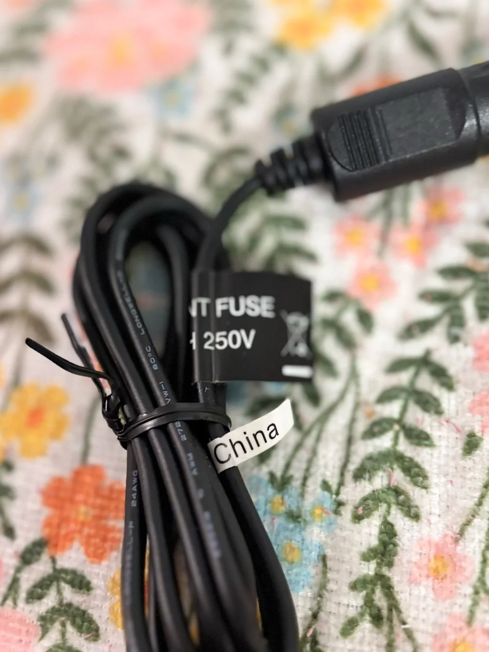 12V DC vehicle power adapter commonly used to charge portable devices